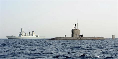 Trafalgar class nuclear submarine HMS Triumph and air defence destroyer HMS Daring as seen ...