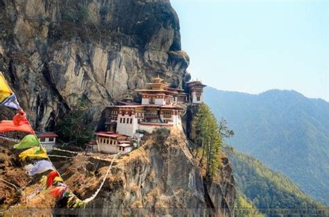 A Buddhist Monastery nestled precariously in the Himalayas, Bhutan | Bhutan travel, Bhutan ...