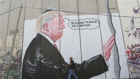 West Bank barrier graffiti mocks Trump's love of walls