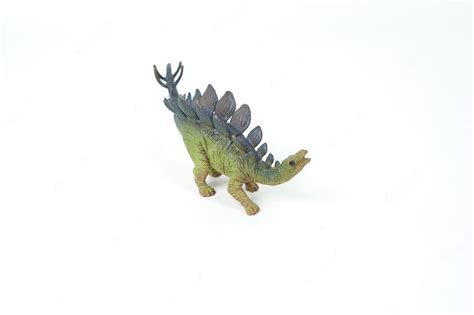 Premium Photo | Dinosaur. plastic rubber toy isolated on white.