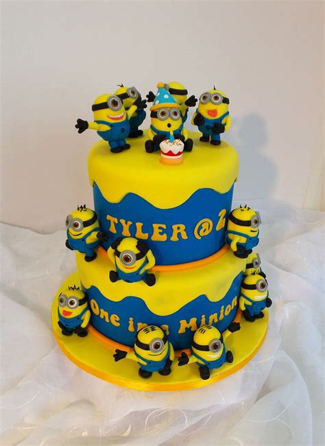 Two tier Minion themed birthday cake | Minion cake, Cake, Themed birthday cakes