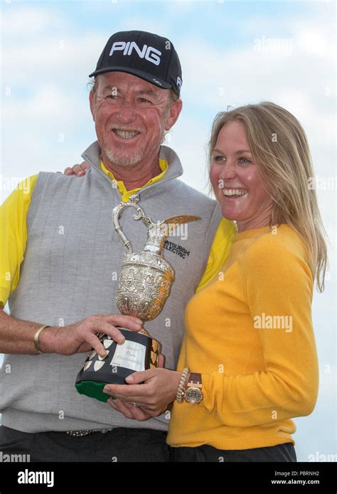 Spain's Miguel Angel Jimenez celebrates with the trophy alongside his ...