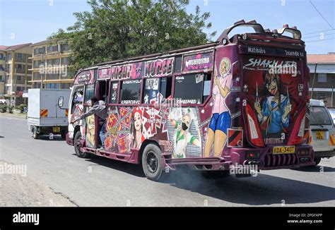 KENYA, Nairobi, Graffiti street art and traffic, colorful painted SACCO mini bus Matatu / KENIA ...