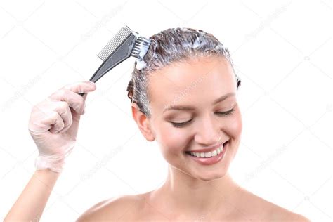 Woman dyeing hair — Stock Photo © belchonock #148326219