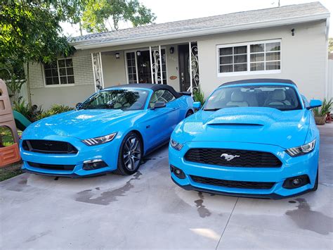 Seeing double! Near twin grabber blue convertibles under my name... : r/Mustang