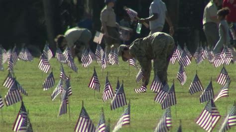 Volunteers place more than 25,000 flags at Bay Pines National Cemetery ahead of Memorial Day ...