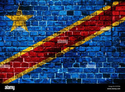 National flag of Democratic Republic of Congo on a brick background ...