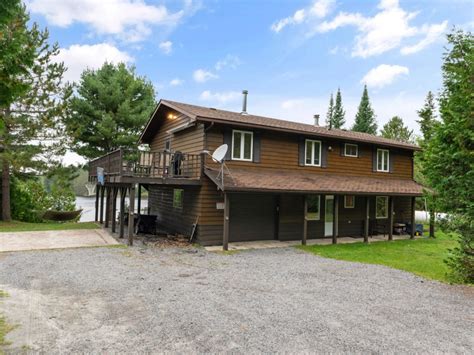 This 4-season home on Forest Lake is listed for less than $900K ...