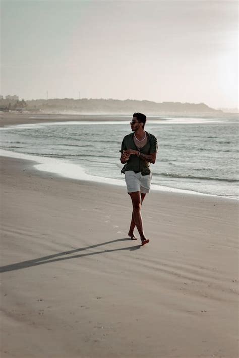 Man Walking on the Beach · Free Stock Photo