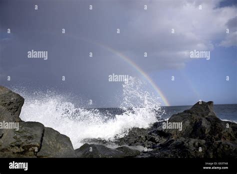 ocean waves and rainbow Stock Photo - Alamy