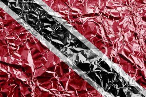 Trinidad and Tobago Flag Depicted in Paint Colors on Shiny Crumpled Aluminium Foil Closeup ...