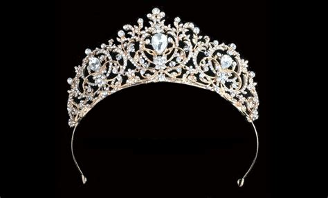 "Majestic rhinestone tiara with hand wired crystals. 2.75\" x 8.5\" Available in silver, gold or ...