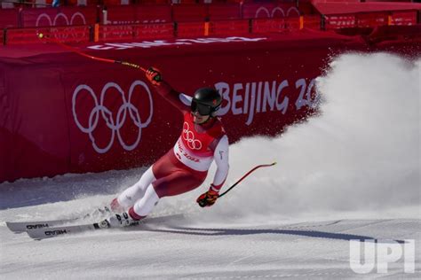 Photo: Winners hold up medals at the Men's Downhill race at the Beijing 2022 Winter Olympics ...