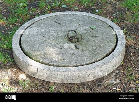 Concrete lid at septic tank reservoir Stock Photo - Alamy