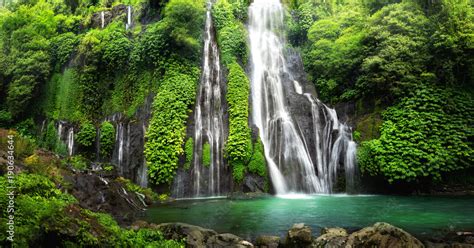 Jungle waterfall cascade in tropical rainforest with rock and turquoise ...