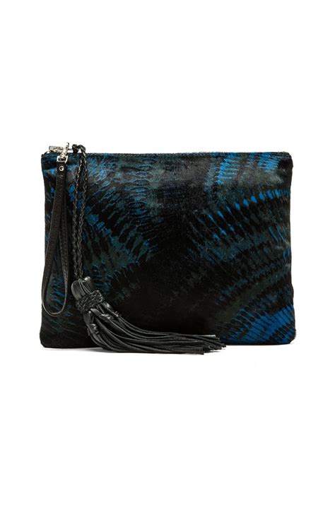 Simone Camille The Dash Clutch in Olive & Multi Fan Print from Revolve ...