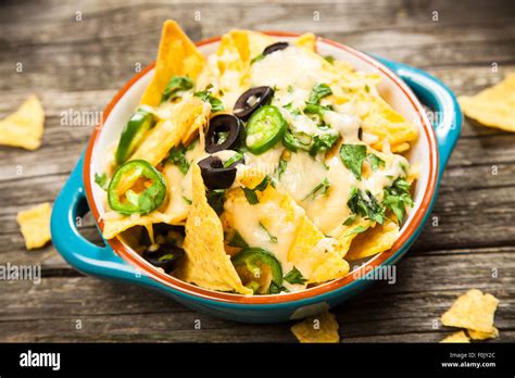 Nachos with melted cheese Stock Photo - Alamy