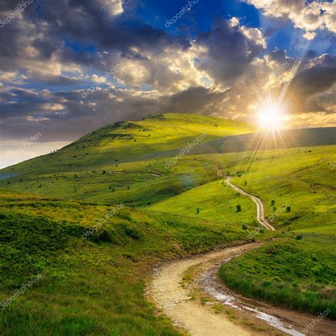 Mountain path uphill to the sky at sunset Stock Photo by ©pellinni 48782471