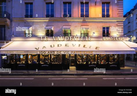 The traditional French brasserie Le Vaudeville at night. It is located near Brogniart palace in ...