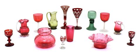 Lot 202 - A collection of cranberry glass,