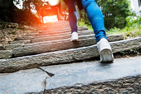 Young Woman Walking Up The Stone Stairs Stock Photo - Download Image Now - iStock