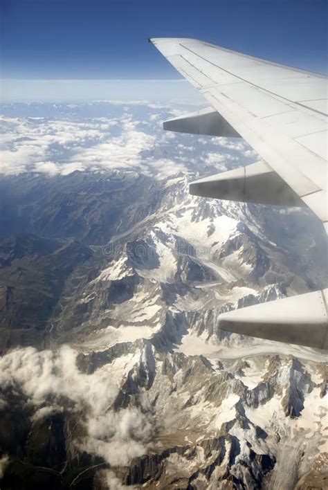 Aircraft Flying Over Mountains Stock Photo - Image of journey, mountains: 3203020