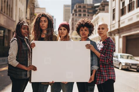 Female protesters with blank banner stock photo (162722) - YouWorkForThem