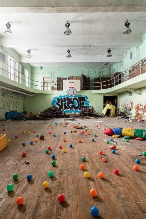 An abandoned elementary school gym that has been ransacked by vandals ...