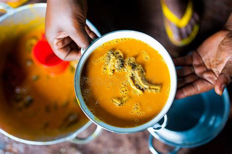 Hands of Cameroonian Woman Holding Pot of Traditional Taro with Sauce ...