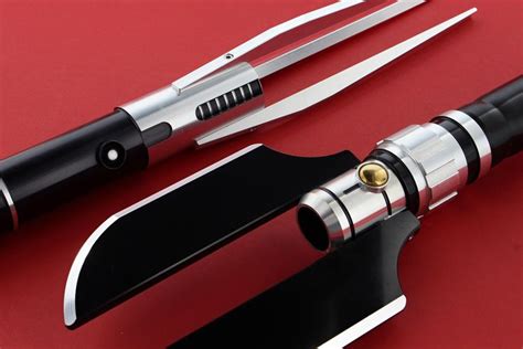 two different types of knifes on a red surface with black handles and ...