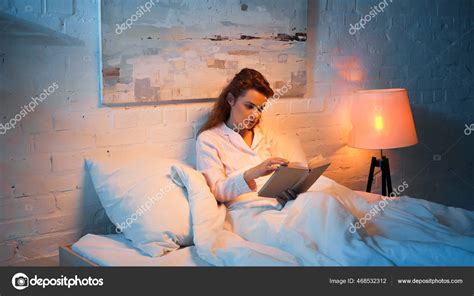 Woman Pajama Reading Book Floor Lamp Bedroom ⬇ Stock Photo, Image by © AntonLozovoy #468532312