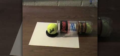 How to Make a DIY tennis ball cannon out of a soda can and rubber bands « Specialized Weapons ...