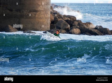 Surfer surfing in Estoril Cascais Portugal Stock Photo - Alamy