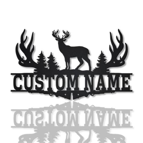 a metal sign that says custom name and a deer with antlers