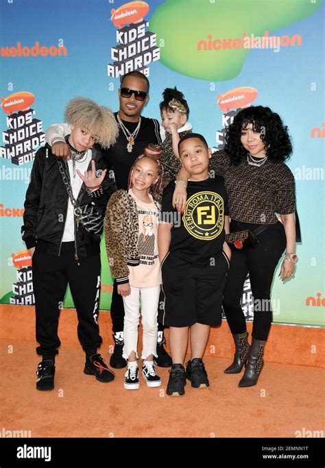 rapper T.I. (C), wife singer-songwriter Tiny (R) and their children (from L) Clifford 'King ...