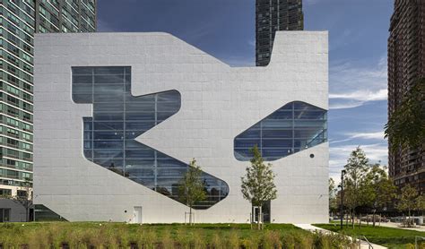 Steven Holl Architects completes Hunters Point Library with flowing sculpted cuts in New York