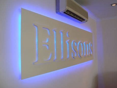 LED lighting behind logo | Logo wall, Wall logo, Home decor decals