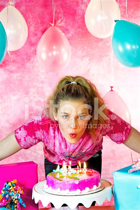 Young Girl Blowing Out Birthday Candles Stock Photo | Royalty-Free | FreeImages