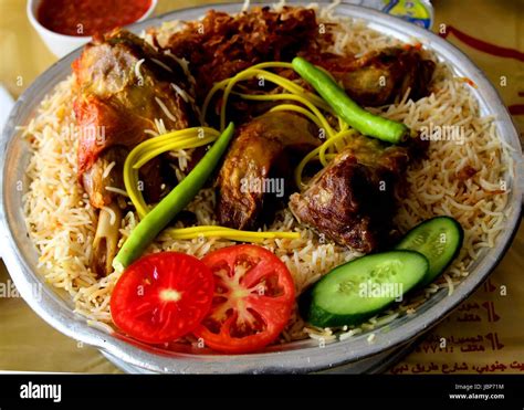 traditional, delicious Arabic cuisine , mandi rice with lamb meat / lahm Stock Photo - Alamy