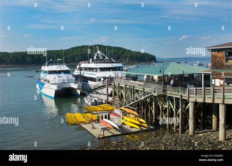 Bar Harbor Maine harbor with tourist whale watching boat on water with ...