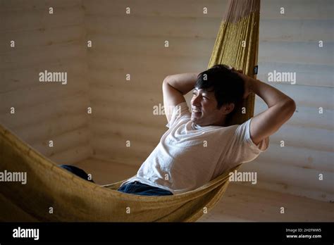 Man Relaxing in Hammock Stock Photo - Alamy