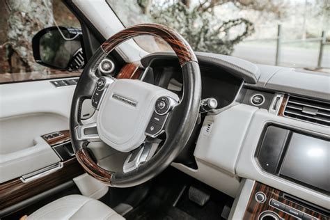 The interior of a car with a steering wheel photo – Free ...