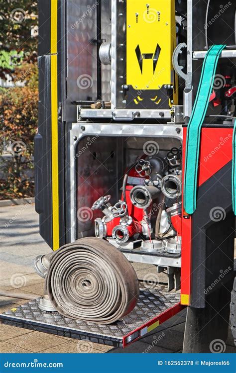 Part of the Fire Truck with Hose Stock Photo - Image of water, spraying ...