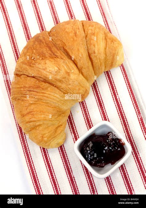 A croissant served with jam Stock Photo - Alamy