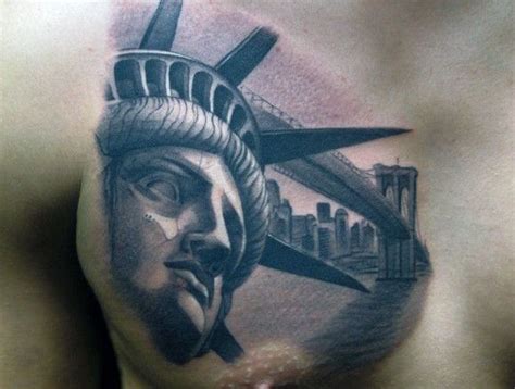 a man's chest with the statue of liberty on it