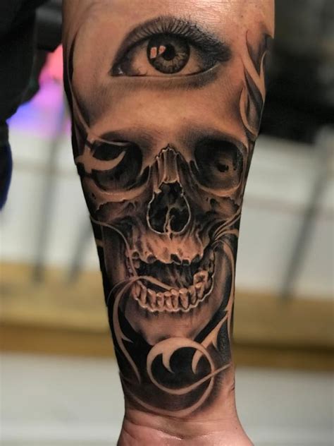 Skull and eyeball tattoo by Jay Michalak: TattooNOW