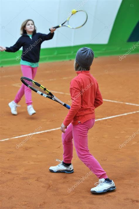 Two girls in training tennis Stock Photo by ©giovannicaito2 64679263