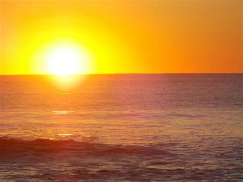 Free stock photo of sun rising on the beach