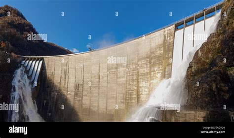 Dam of Contra Verzasca Ticino, Switzerland: spectacular waterfalls from the overflow of the lake ...