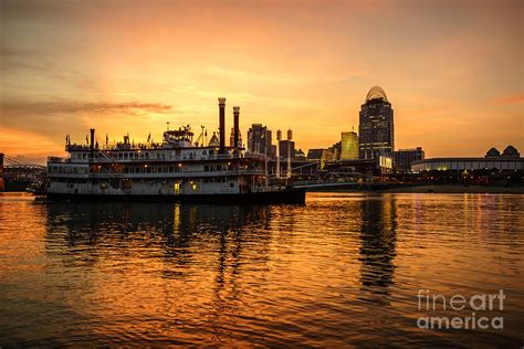 Cincinnati Skyline and Riverboat at Sunset Photograph by Paul Velgos - Pixels